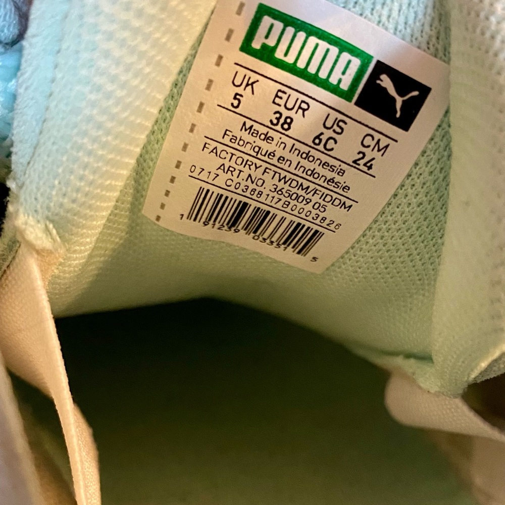 Women’s Puma tennis shoes- light blue in color with white trim- size 6.